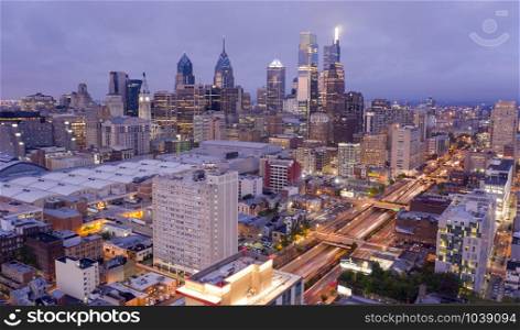 The office lights are bright as night comes to the city center of Philadelphia PA