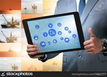 The oil worker in remote operations concept in oil industry. Oil worker in remote operations concept in oil industry