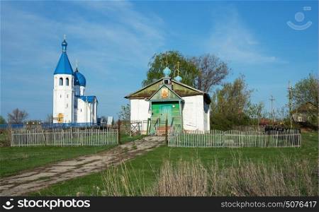 The old and the new church in the village of Russia