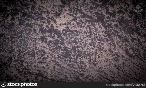 The old concrete wall background texture has a rough black pattern.