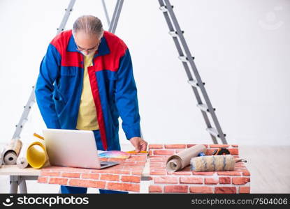 The old contractor doing renovation at home. Old contractor doing renovation at home