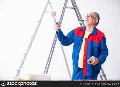 The old contractor doing renovation at home. Old contractor doing renovation at home