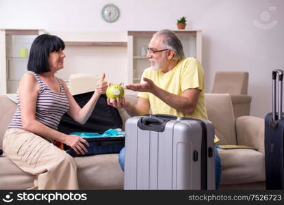 The old couple preparing for vacation travel. Old couple preparing for vacation travel