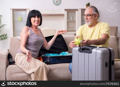 The old couple preparing for vacation travel. Old couple preparing for vacation travel