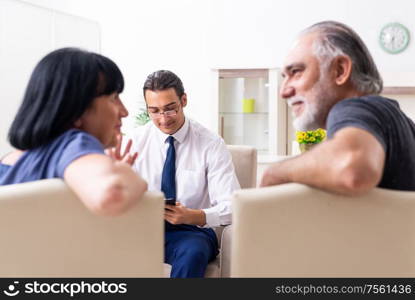 The old couple visiting psychiatrist doctor. Old couple visiting psychiatrist doctor