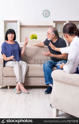 The old couple visiting psychiatrist doctor. Old couple visiting psychiatrist doctor