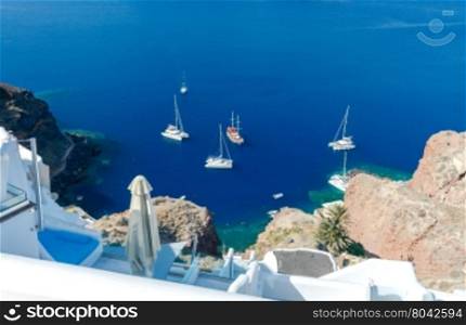 The old fishing harbor in the village Oia.. Old Port in the village Oia on Santorini island in the Aegean Sea. Greece.