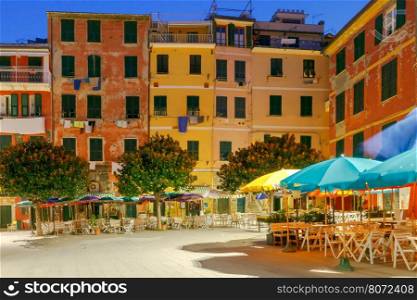 The old main square on the waterfront in the Italian village of Vernazza at night. Parco Nazionale delle Cinque Terre, Liguria, Italy.