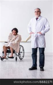 The old male doctor psychiatrist and patient in wheel-chair  . Old male doctor psychiatrist and patient in wheel-chair  
