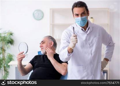 The old man visiting young doctor for plastic surgery. Old man visiting young doctor for plastic surgery