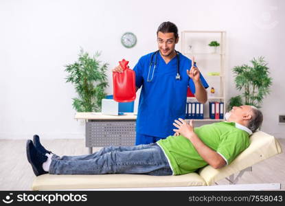 The old man visiting young male doctor gastroenterologist. Old man visiting young male doctor gastroenterologist