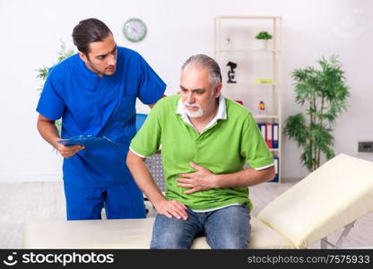 The old man visiting young male doctor gastroenterologist. Old man visiting young male doctor gastroenterologist