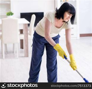 The old mature woman tired after house chores. Old mature woman tired after house chores