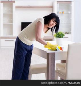 The old mature woman tired after house chores. Old mature woman tired after house chores