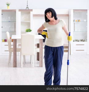 The old mature woman tired after house chores. Old mature woman tired after house chores