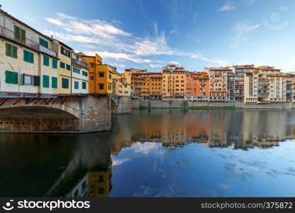 The old medieval bridge Ponte Vecchio at sunset. Florence. Italy.. Florence. Ponte Vecchio.