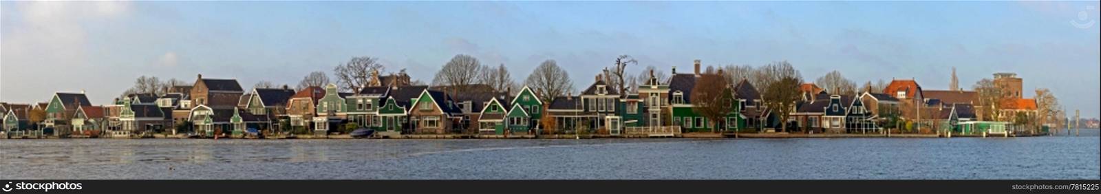 The old, picturesque houses of Zaanse Schans along the river side of the Zaan on a cold winter morning