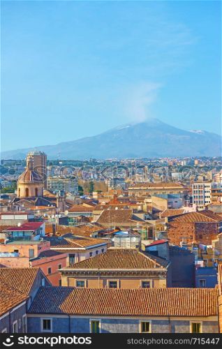 The old town of Catania and Mount Etna volcano, Sicily, Italy