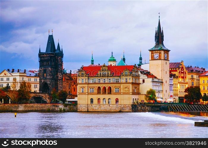 The Old Town with Charles bridge tower in Prague in the evening