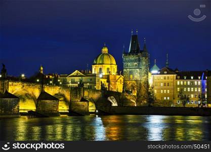 The Old Town with Charles bridge tower in Prague in the evening