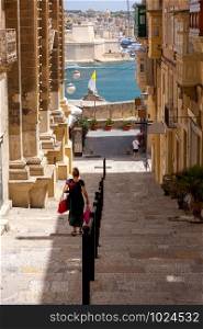 The old typical narrow medieval street in Valletta. Malta.. Valletta. Old medieval street.