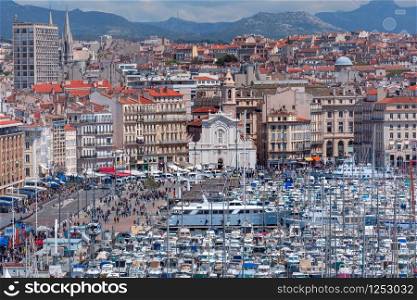 The old Vieux Port and Church of Saint Ferreol - Augustinians in the historical city center of Marseilles on sunny day, France. Old Vieux Port Marseille, France