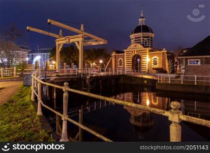The old western city gate of Morsport at night. Leiden. Netherlands.. The old city gate Morspoort in Leiden at sunrise.