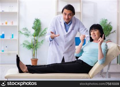 The old woman visiting young doctor dentist. Old woman visiting young doctor dentist