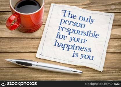 The only person responsible for your happiness is you - inspirational handwriting on a napkin with a cup of coffee