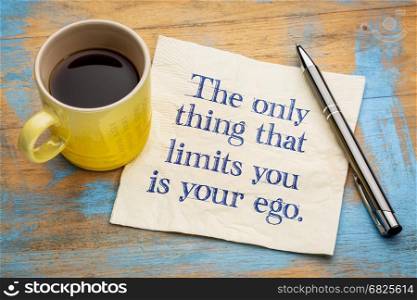 The only thing that limits you is your ego - handwriting on a napkin with a cup of espresso coffee