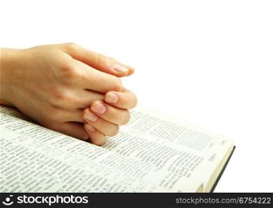 The opened bible is isolated on a white background