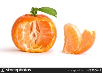 the opened tangerine with leaf isolated