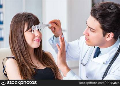 The ophthalmologist is checking up patient in eye doctor hospital. Ophthalmologist is checking up patient in eye doctor hospital