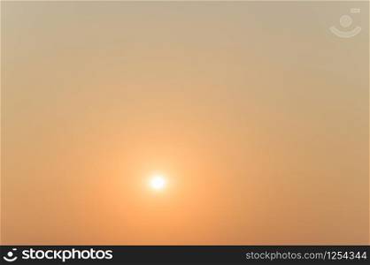 The orange background background with the rising sun in the morning