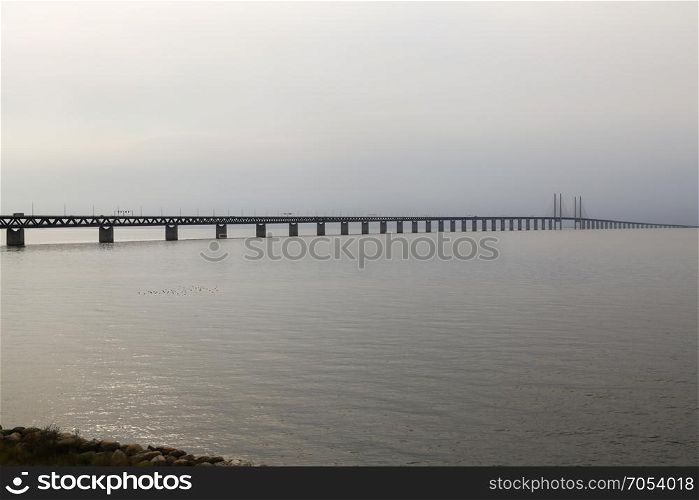 The Oresund Bridge connects Sweden and Denmark and is a combined twin-track railroad and four-lane highway bridge-tunnel across the Oresund strait.