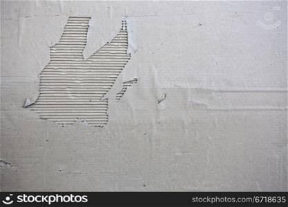 The oThe old torn cardboard banner, in monochromeld torn cardboard banner, in monochrome