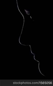 The outline of a young woman's face