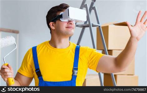The painter contractor working with virtual reality goggles. Painter contractor working with virtual reality goggles