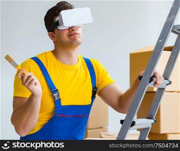 The painter contractor working with virtual reality goggles. Painter contractor working with virtual reality goggles
