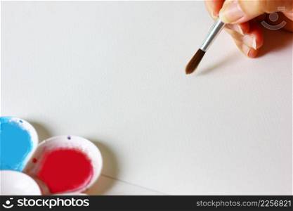 the painter painting on white paper
