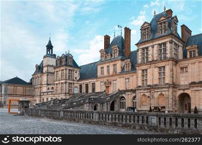 The Palace of Fontainebleau at daylight. View from bottom. France landmarks. The Palace of Fontainebleau at daylight