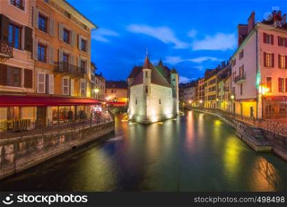 The Palais de l'Isle and Thiou river at night in old city of Annecy, Venice of the Alps, France. Annecy, called Venice of the Alps, France