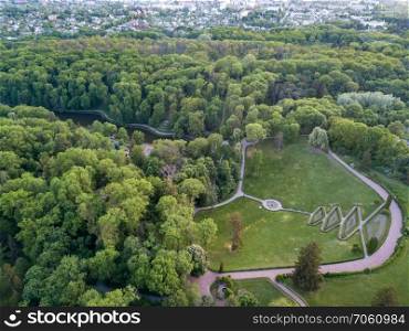 The panoramic bird’s eye view shooting from drone of west part of dendrological park with parterre&hitheater and flower beds in regular style in Sofiyivka Park and Uman, Ukraine. Aerial panoramic view from the drone to the national dendrological park Sofiyivka in city Uman, Ukraine in the summer at sunset
