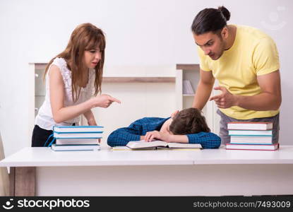 The parents helping their son to prepare for school. Parents helping their son to prepare for school