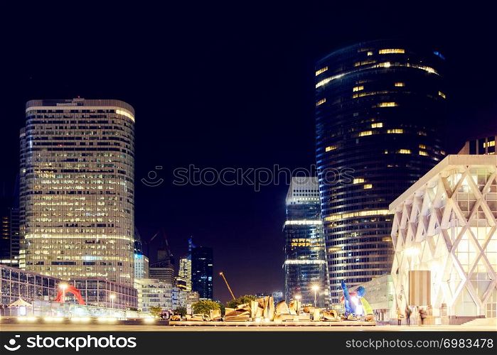 "The Paris city at night. Street lights and glass business towers, France. The "coeur defense" tower"