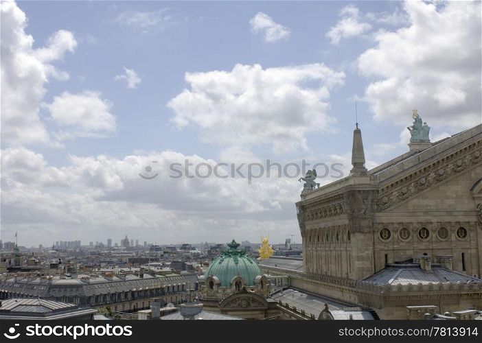 The Paris skyline with the Opera building in the right foreground on a summer day with a slight haze