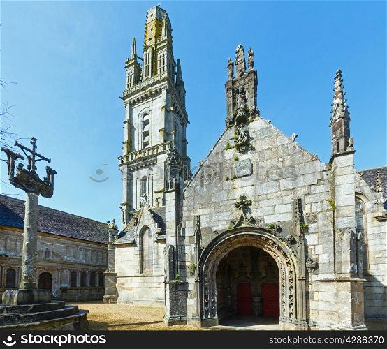The parish of Lampaul-Guimiliau dedicated to St Paulinus and dating 16-17 century. Brittany, France. Spring view.
