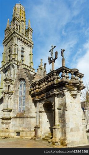 The parish of Lampaul-Guimiliau dedicated to St Paulinus and dating 16-17 century. Brittany, France. Spring view.