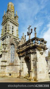 The parish of Lampaul-Guimiliau dedicated to St Paulinus and dating 16-17 century. Brittany, France. Spring view.