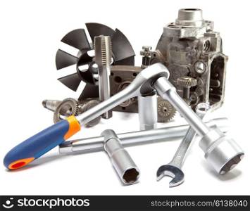 the part of car high pressure pump and the tool for repair on white background
